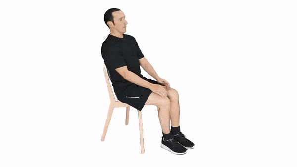 man performing single knee to chest stretch to help with lower back pain