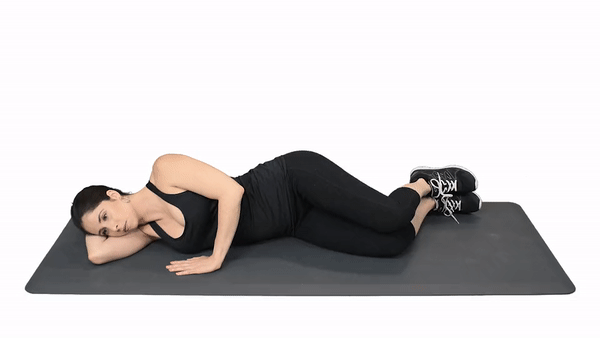 woman performing clamshells exercise