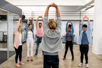 Employees workout as part of a workplace wellness program.