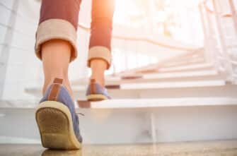 Woman takes the stairs to stay active.