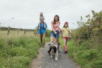 Parents find work-life balance on a midday walk with their family.